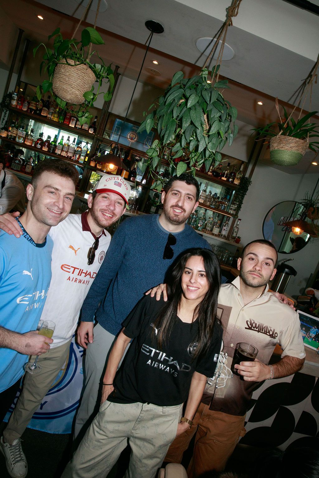 Four guests posing together inside the event venue