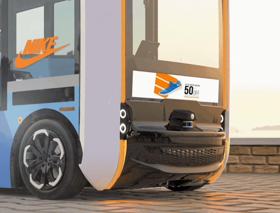 Close view of an autonomous shuttle showing a Nike campaign