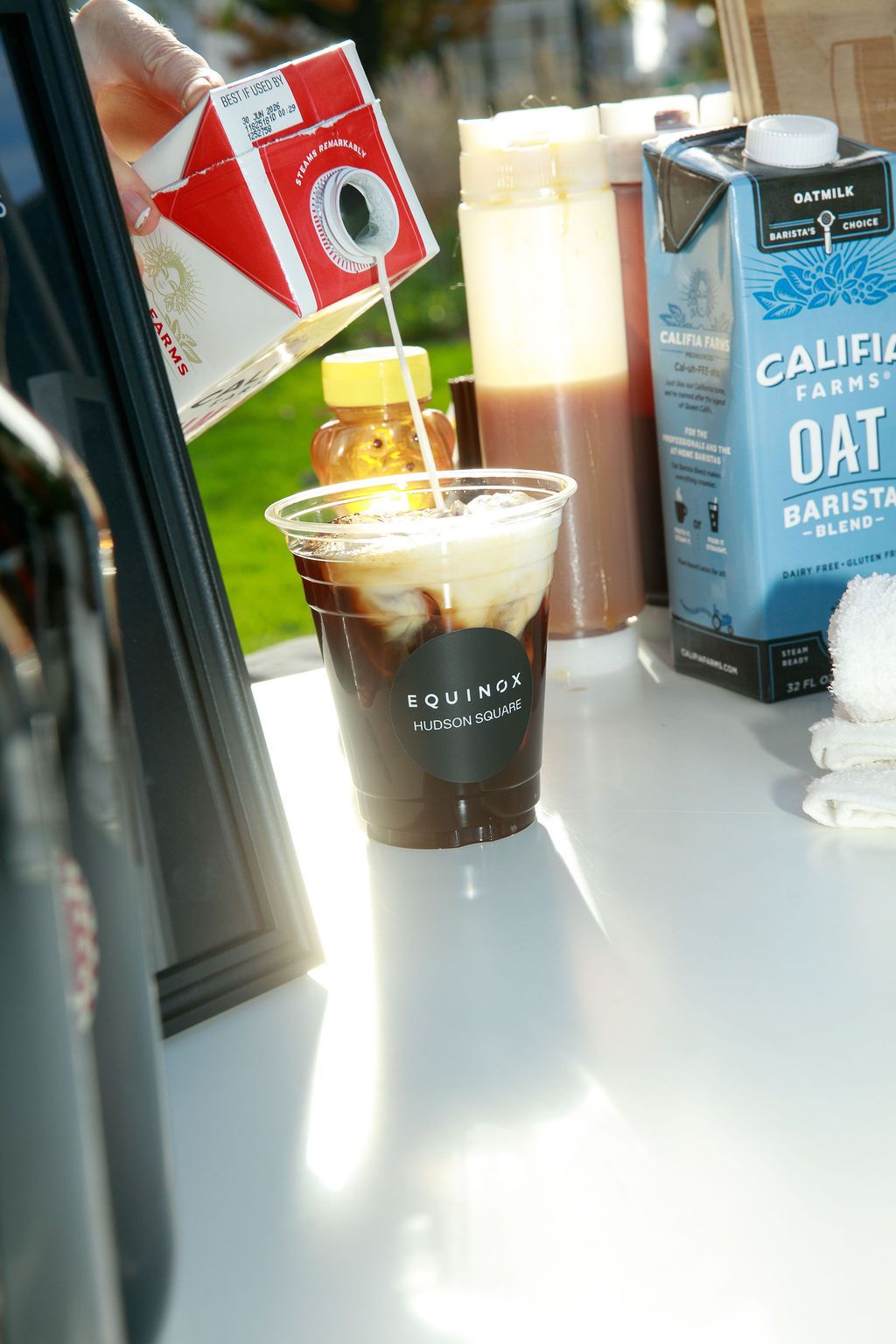 Iced coffee beside milk cartons at the Hudson Square activation