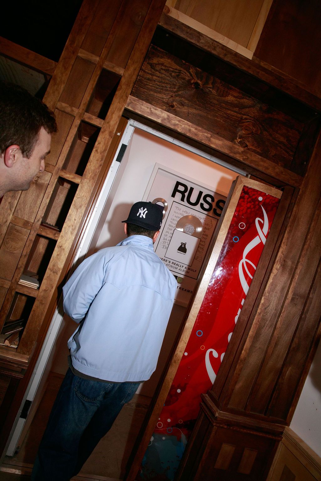Guest walking past football artwork inside the venue