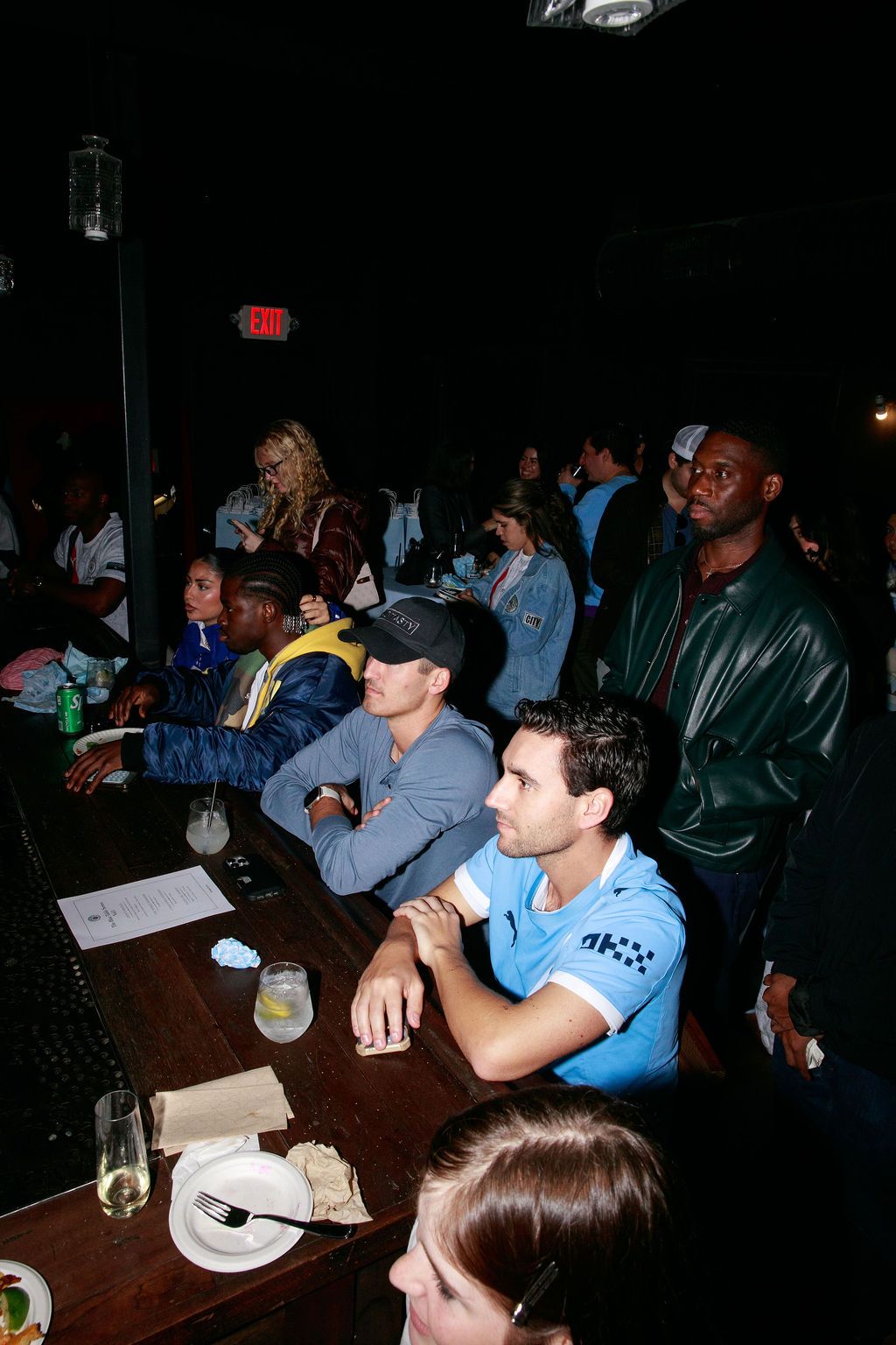 Fans seated together watching the Manchester City event